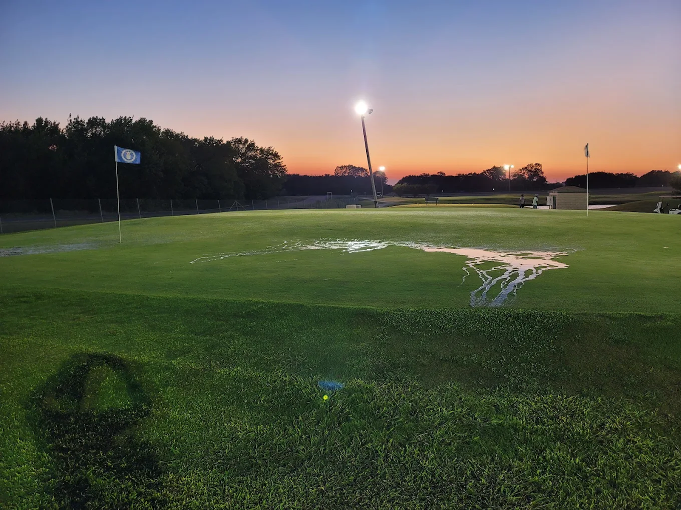 Lighted Par 3 green at sunset